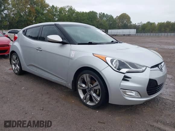 2013 Hyundai Veloster w/Black Int z VIN KMHTC6AD8DU094583, wystawiony jako IAAI lot #43366392 z przebiegiem 135 081 mil mil oraz . Historia ofert i sprzedaży dostępna na DreamBid. Obrazek 1.