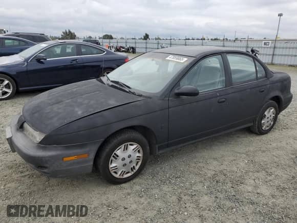 1996 Saturn SL z VIN 1G8ZH5288TZ202529, wystawiony jako Copart lot #47859865 z przebiegiem 135 406 mil mil oraz Szkoda całkowita • Salvage title. Historia ofert i sprzedaży dostępna na DreamBid. Obrazek 1.