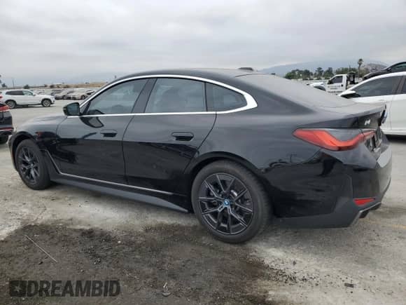 2024 BMW i4 eDrive35 with VIN WBY43AW05RFS57427, listed as a Copart auction lot 65464855 with 7,096 mi miles and Salvage title. Bid and sale history available at DreamBid. Image 2.