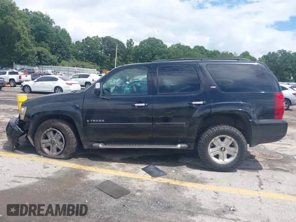 2007 Chevrolet Tahoe LT with VIN 1GNFC13037R423235, listed as a IAAI auction lot 42992915 with 148,780 mi miles and . Bid and sale history available at DreamBid. Image 14.