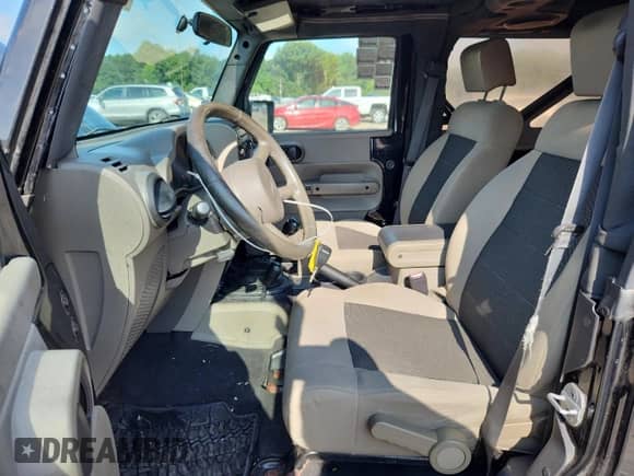 2009 Jeep Wrangler X z VIN 1J4FA241X9L750596, wystawiony jako Copart lot #61362375 z przebiegiem 318 716 mil mil oraz Szkoda całkowita • Salvage title. Historia ofert i sprzedaży dostępna na DreamBid. Obrazek 7.