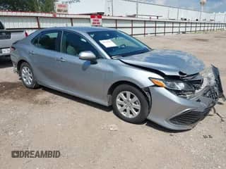 2021 Toyota Camry Hybrid LE with VIN 4T1C31AK3MU549454, listed as a IAAI auction lot 43138660 with 144,272 mi miles and . Bid and sale history available at DreamBid. Image 1.