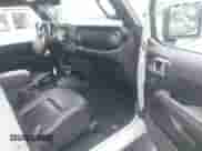 2023 Jeep Wrangler Sahara with VIN 1C4JJXP67PW604835, listed as a IAAI auction lot 42431648 with 15,209 mi miles and . Bid and sale history available at DreamBid. Image 5.