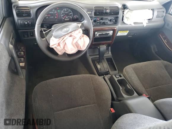 2000 Honda Passport LX with VIN 4S6CK58W3Y4401322, listed as a Copart auction lot 70466595 with 189,630 mi miles and Salvage title. Bid and sale history available at DreamBid. Image 8.