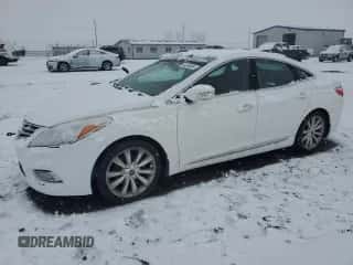 2013 Hyundai Azera z VIN KMHFH4JG5DA284078, wystawiony jako Copart lot #84546694 z przebiegiem 122 111 mil mil oraz Szkoda całkowita • Salvage title. Historia ofert i sprzedaży dostępna na DreamBid. Obrazek 1.