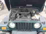 1999 Jeep Wrangler Sahara z VIN 1J4FY49S5XP482037, wystawiony jako IAAI lot #42341723 z przebiegiem 161 081 mil mil oraz . Historia ofert i sprzedaży dostępna na DreamBid. Obrazek 10.