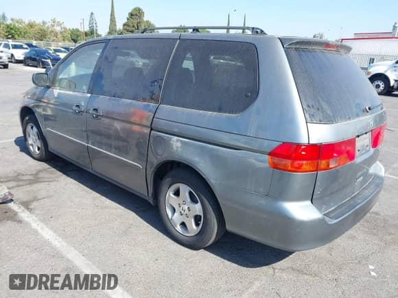 2000 Honda Odyssey EX with VIN 2HKRL186XYH593393, listed as a IAAI auction lot 42877242 with 164,593 mi miles and . Bid and sale history available at DreamBid. Image 3.