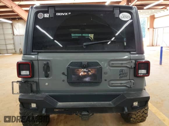 2021 Jeep Wrangler Unlimited Sport Altitude with VIN 1C4HJXDN7MW562351, listed as a Copart auction lot 84832735 with 82,697 mi miles and Salvage title. Bid and sale history available at DreamBid. Image 6.