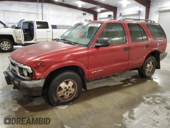 1997 Chevrolet Blazer LS z VIN 1GNDT13WXV2224393, wystawiony jako Copart lot #86080255 z przebiegiem 365 696 mil mil oraz Szkoda całkowita • Salvage title. Historia ofert i sprzedaży dostępna na DreamBid. Obrazek 1.