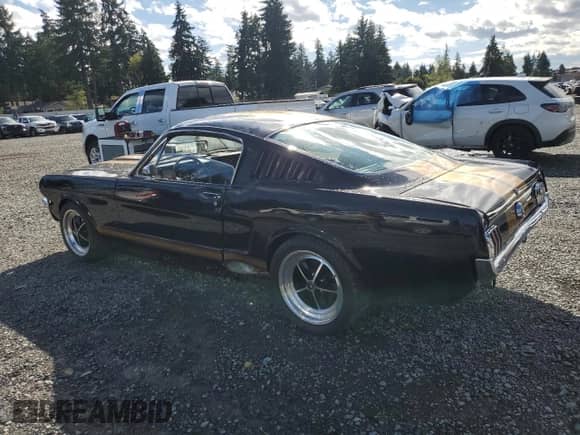 1965 Ford Mustang with VIN 5R09T186141, listed as a Copart auction lot 82097995 with 95,802 mi miles and Salvage title. Bid and sale history available at DreamBid. Image 2.