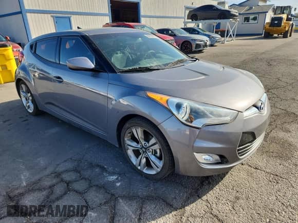 2013 Hyundai Veloster w/Gray Int z VIN KMHTC6AD9DU150403, wystawiony jako Copart lot #82136875 z przebiegiem 122 481 mil mil oraz Szkoda całkowita • Salvage title. Historia ofert i sprzedaży dostępna na DreamBid. Obrazek 4.