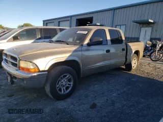 2003 Dodge Dakota SLT with VIN 1D7HL48N53S104919, listed as a Copart auction lot 86832215 with 179,130 mi miles and Salvage title. Bid and sale history available at DreamBid. Image 1.