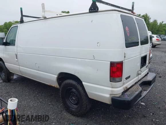 2003 Ford Econoline Cargo with VIN 1FTNE24W13HA46279, listed as a IAAI auction lot 42482660 with 250,712 mi miles and . Bid and sale history available at DreamBid. Image 3.
