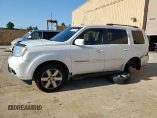 2014 Honda Pilot Touring z VIN 5FNYF3H96EB001670, wystawiony jako Copart lot #70638295 z przebiegiem 163 468 mil mil oraz Szkoda całkowita • Salvage title. Historia ofert i sprzedaży dostępna na DreamBid. Obrazek 1.