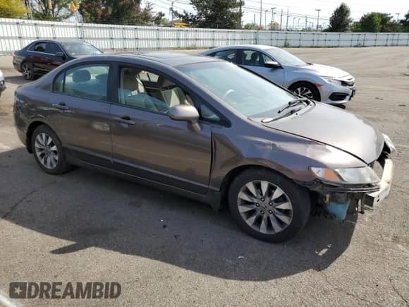 2010 Honda Civic with VIN 19FXA1F8XAE019092, listed as a Copart auction lot 71496354 with 185,077 mi miles and Salvage title. Bid and sale history available at DreamBid. Image 4.