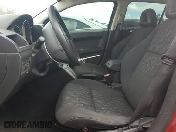 2009 Dodge Caliber SE with VIN 1B3HB28A69D258777, listed as a Copart auction lot 56851875 with 129,819 mi miles and Clean title. Bid and sale history available at DreamBid. Image 7.
