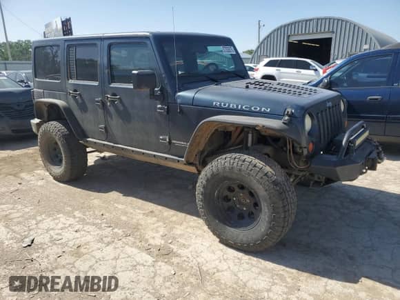 2008 Jeep Wrangler Unlimited Rubicon z VIN 1J8GA69198L550682, wystawiony jako Copart lot #57333575 z przebiegiem 176 224 mil mil oraz Szkoda całkowita • Salvage title. Historia ofert i sprzedaży dostępna na DreamBid. Obrazek 4.
