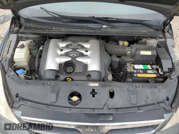 2007 Hyundai Entourage GLS with VIN KNDMC233376023404, listed as a Copart auction lot 69413625 with 135,989 mi miles and Salvage title. Bid and sale history available at DreamBid. Image 12.