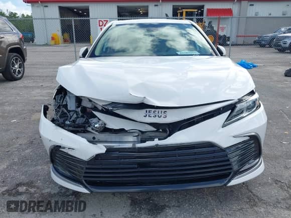 2021 Toyota Camry LE with VIN 4T1C11AK8MU601313, listed as a IAAI auction lot 43383218 with 34,384 mi miles and . Bid and sale history available at DreamBid. Image 6.