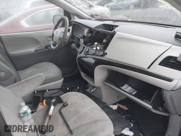 2014 Toyota Sienna L with VIN 5TDZK3DC1ES452065, listed as a IAAI auction lot 42328789 with Not provided miles and . Bid and sale history available at DreamBid. Image 5.