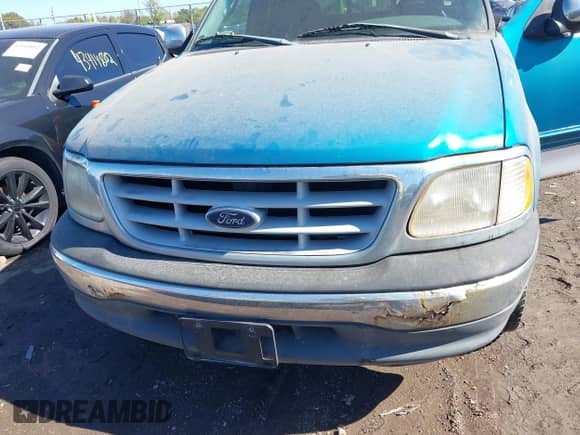 1999 Ford F-150 z VIN 1FTRX17W8XKA28419, wystawiony jako IAAI lot #43427768 z przebiegiem Nie podano mil oraz . Historia ofert i sprzedaży dostępna na DreamBid. Obrazek 6.