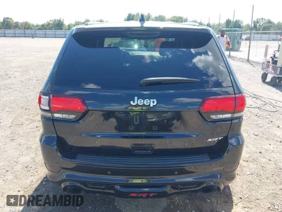 2015 Jeep Grand Cherokee SRT with VIN 1C4RJFDJ4FC853745, listed as a IAAI auction lot 43327828 with 68,614 mi miles and . Bid and sale history available at DreamBid. Image 16.