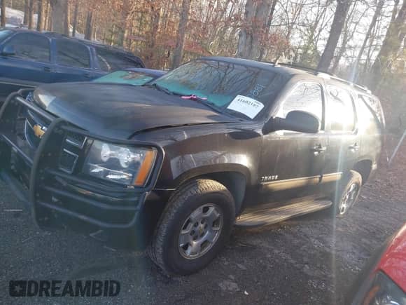 2014 Chevrolet Tahoe LS with VIN 1GNSKAE00ER162786, listed as a IAAI auction lot 41602182 with 189,890 mi miles and . Bid and sale history available at DreamBid. Image 14.