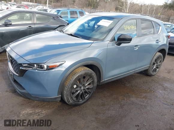 2022 Mazda CX-5 S Carbon Edition z VIN JM3KFBCM7N0579780, wystawiony jako IAAI lot #41460860 z przebiegiem 43 479 mil mil oraz . Historia ofert i sprzedaży dostępna na DreamBid. Obrazek 2.
