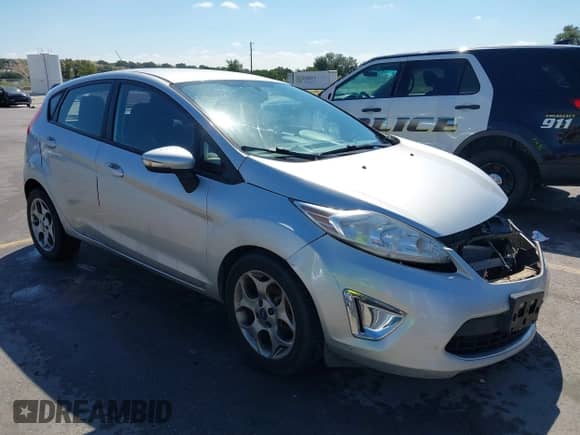 2011 Ford Fiesta SES with VIN 3FADP4FJ9BM146004, listed as a IAAI auction lot 43277473 with 147,864 mi miles and . Bid and sale history available at DreamBid. Image 1.