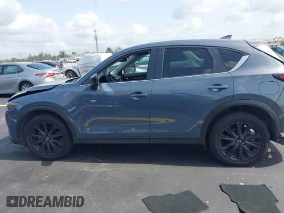 2023 Mazda CX-5 S Carbon Edition z VIN JM3KFBCM6P0171807, wystawiony jako IAAI lot #42450088 z przebiegiem 40 146 mil mil oraz . Historia ofert i sprzedaży dostępna na DreamBid. Obrazek 14.
