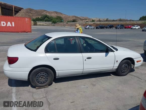 2002 Saturn SL с VIN 1G8ZH52802Z154555, выставлен на аукционе IAAI как лот 42771346 с пробегом 248 496 миль миль и . История ставок и продаж доступна на DreamBid. Изображение 13.