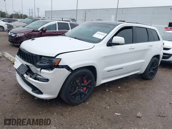 2016 Jeep Grand Cherokee SRT with VIN 1C4RJFDJ0GC456325, listed as a IAAI auction lot 41425211 with 159,746 mi miles and . Bid and sale history available at DreamBid. Image 21.