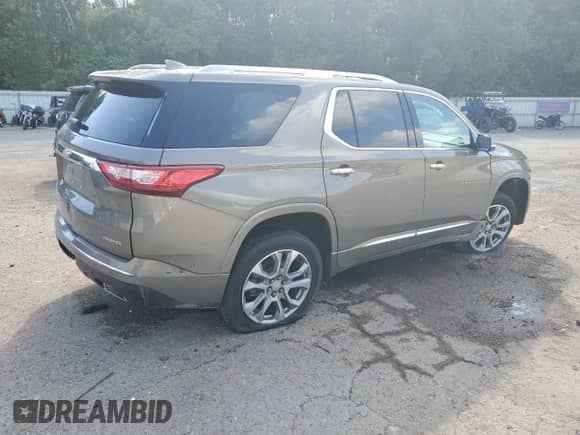 2020 Chevrolet Traverse Premier with VIN 1GNERKKWXLJ140331, listed as a Copart auction lot 65239205 with 130,424 mi miles and Salvage title. Bid and sale history available at DreamBid. Image 3.