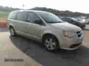 2013 Dodge Grand Caravan SE with VIN 2C4RDGBG0DR535890, listed as a IAAI auction lot 40304162 with 134,857 mi miles and . Bid and sale history available at DreamBid. Image 1.