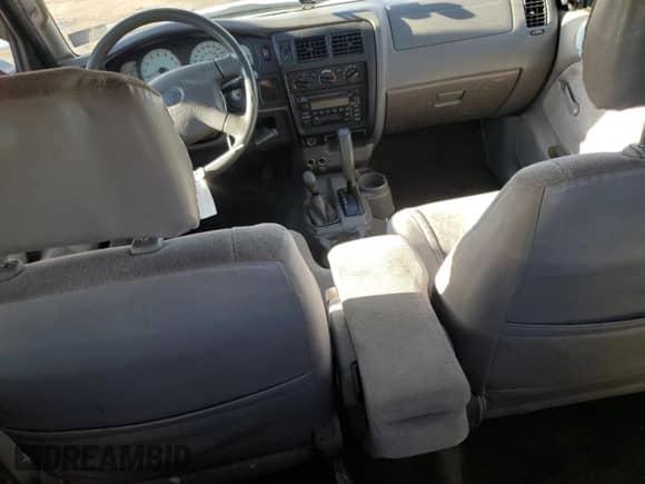 2003 Toyota Tacoma z VIN 5TEWM72N03Z172176, wystawiony jako Copart lot #87448195 z przebiegiem 276 730 mil mil oraz Szkoda całkowita • Salvage title. Historia ofert i sprzedaży dostępna na DreamBid. Obrazek 8.
