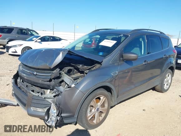 2014 Ford Escape SE with VIN 1FMCU0GX6EUD41631, listed as a IAAI auction lot 41209163 with 233,429 mi miles and . Bid and sale history available at DreamBid. Image 2.