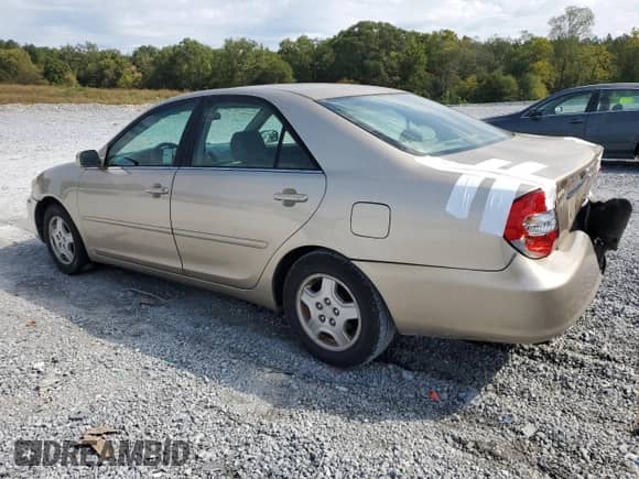 2002 Toyota Camry LE with VIN 4T1BF30K82U510808, listed as a Copart auction lot 82227885 with 160,970 mi miles and Salvage title. Bid and sale history available at DreamBid. Image 2.