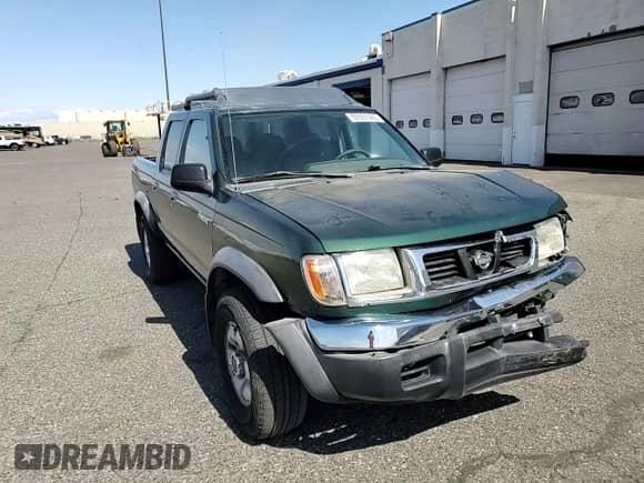 2000 Nissan Frontier XE with VIN 1N6ED27YXYC397550, listed as a Copart auction lot 59397465 with 119,247 mi miles and Salvage title. Bid and sale history available at DreamBid. Image 14.
