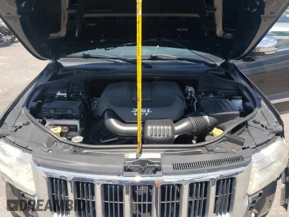 2012 Jeep Grand Cherokee Limited z VIN 1C4RJEBG7CC195450, wystawiony jako Copart lot #60673955 z przebiegiem 121 147 mil mil oraz Szkoda całkowita • Salvage title. Historia ofert i sprzedaży dostępna na DreamBid. Obrazek 12.