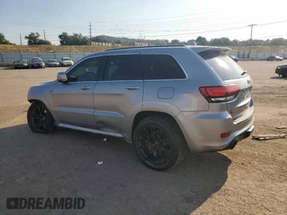 2014 Jeep Grand Cherokee SRT-8 z VIN 1C4RJFDJ6EC191973, wystawiony jako Copart lot #69803205 z przebiegiem 82 537 mil mil oraz Szkoda całkowita • Salvage title. Historia ofert i sprzedaży dostępna na DreamBid. Obrazek 2.