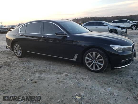 2017 BMW 7 Series 740i xDrive с VIN WBA7E4C55HGU99795, выставлен на аукционе Copart как лот 85545124 с пробегом 99 304 миль миль и Списание • Salvage title. История ставок и продаж доступна на DreamBid. Изображение 4.