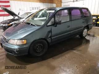 1997 Honda Odyssey LX с VIN JHMRA1868VC018947, выставлен на аукционе Copart как лот 49537135 с пробегом 243 475 миль миль и Чистый • Clean title. История ставок и продаж доступна на DreamBid. Изображение 1.