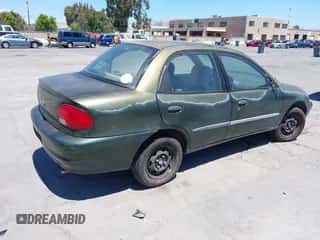 1999 Chevrolet Metro Lsi z VIN 2C1MR5228X6715075, wystawiony jako IAAI lot #42532147 z przebiegiem 155 249 mil mil oraz . Historia ofert i sprzedaży dostępna na DreamBid. Obrazek 4.