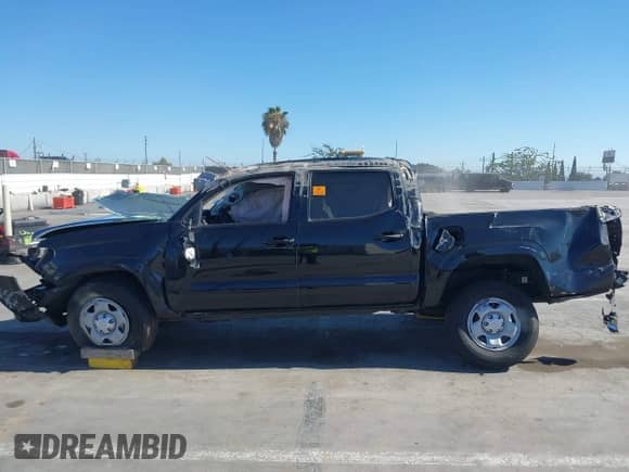 2022 Toyota Tacoma SR with VIN 3TYAX5GNXNT053716, listed as a IAAI auction lot 42853297 with 42,989 mi miles and . Bid and sale history available at DreamBid. Image 14.