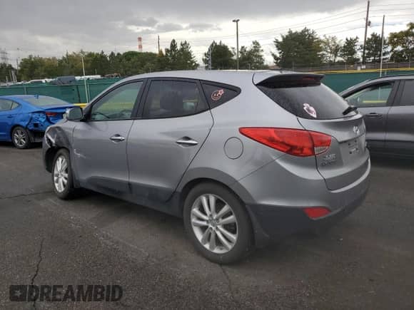 2011 Hyundai Tucson Limited with VIN KM8JUCAC0BU226646, listed as a Copart auction lot 80653715 with 105,174 mi miles and Salvage title. Bid and sale history available at DreamBid. Image 2.