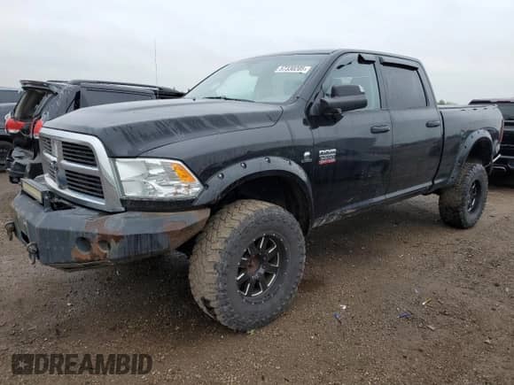 2012 Dodge RAM with VIN 3C63D3DL1CG341325, listed as a Copart auction lot 57330205 with 180,164 mi miles and Salvage title. Bid and sale history available at DreamBid. Image 1.