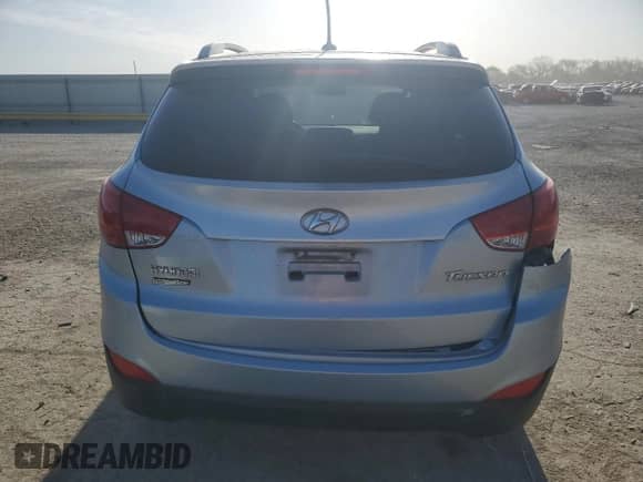 2011 Hyundai Tucson Limited with VIN KM8JU3AC7BU213263, listed as a Copart auction lot 52646455 with 165,236 mi miles and Salvage title. Bid and sale history available at DreamBid. Image 6.