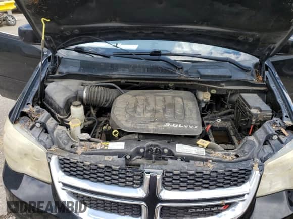 2013 Dodge Grand Caravan SXT с VIN 2C4RDGCG2DR611348, выставлен на аукционе Copart как лот 60001195 с пробегом Не указан миль и Списание • Salvage title. История ставок и продаж доступна на DreamBid. Изображение 12.