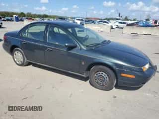 2002 Saturn SL с VIN 1G8ZH52832Z193897, выставлен на аукционе Copart как лот 77690354 с пробегом 151 325 миль миль и Чистый • Clean title. История ставок и продаж доступна на DreamBid. Изображение 4.