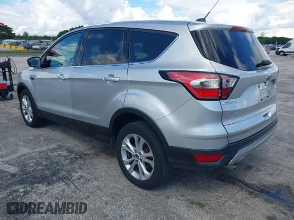 2017 Ford Escape SE with VIN 1FMCU9GD3HUC16133, listed as a IAAI auction lot 43426604 with 126,435 mi miles and . Bid and sale history available at DreamBid. Image 3.